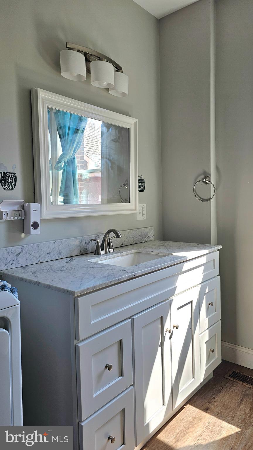 332 Perry Street Columbia, PA 17512 - Photo 17 of 31 a bathroom with a granite countertop sink and a mirror