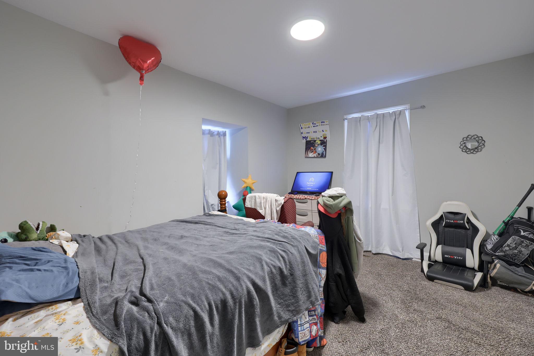 332 Perry Street Columbia, PA 17512 - Photo 21 of 37 a bedroom with a bed and a lamp