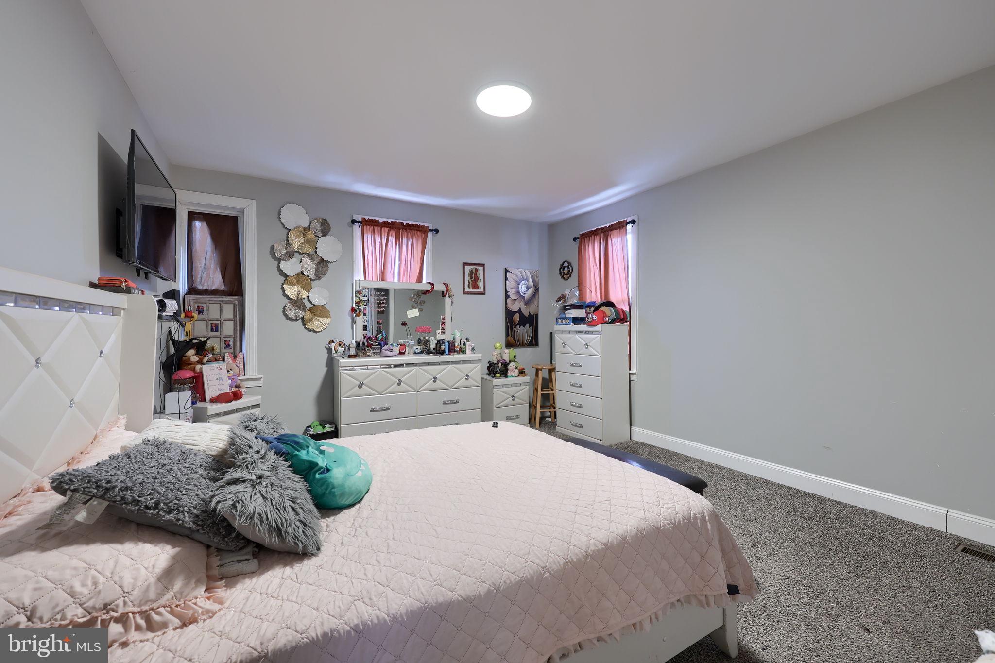 332 Perry Street Columbia, PA 17512 - Photo 23 of 37 a bedroom with a bed window and walk in closet