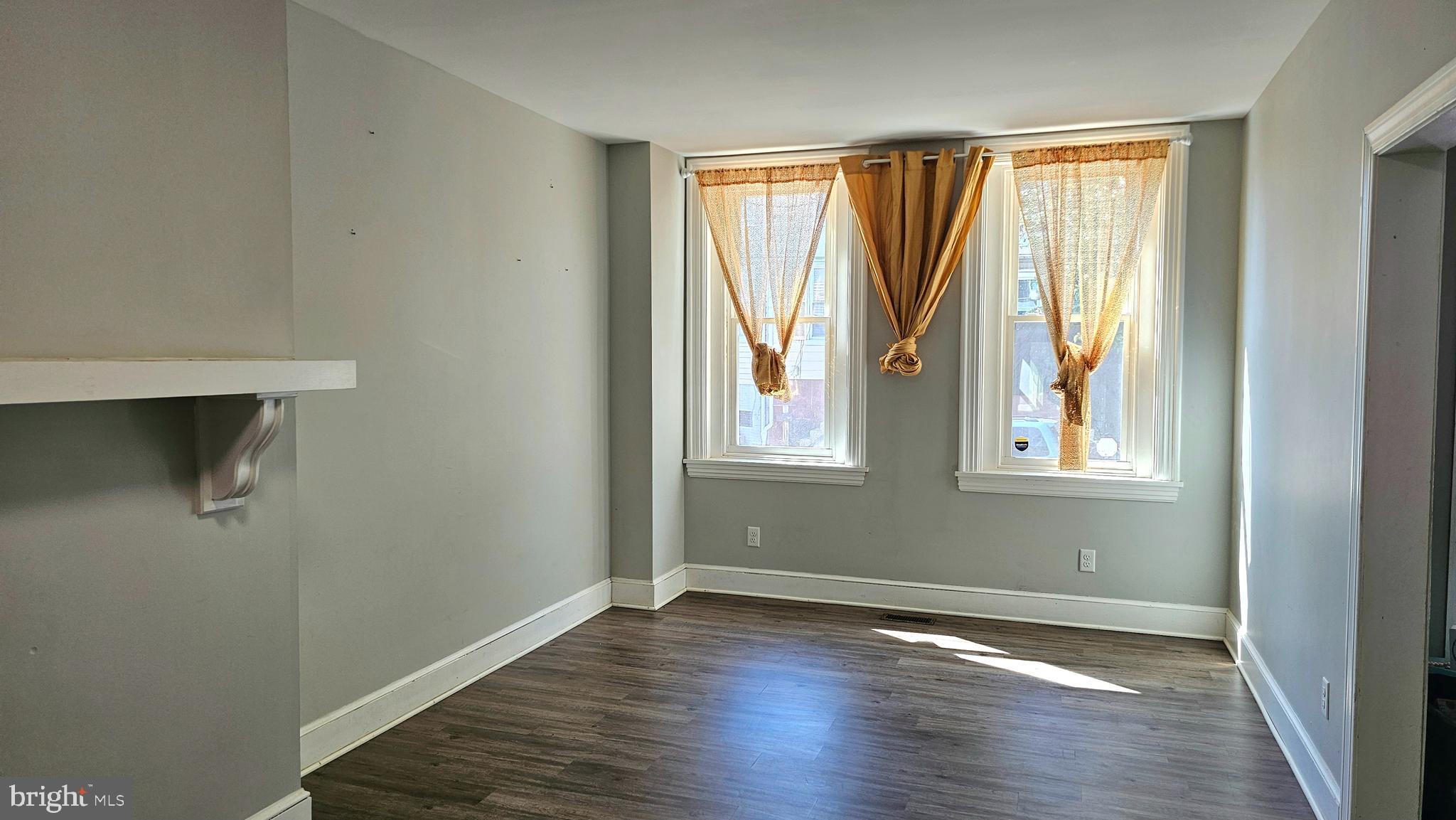332 Perry Street Columbia, PA 17512 - Photo 3 of 31 a view of an empty room with wooden floor and a window