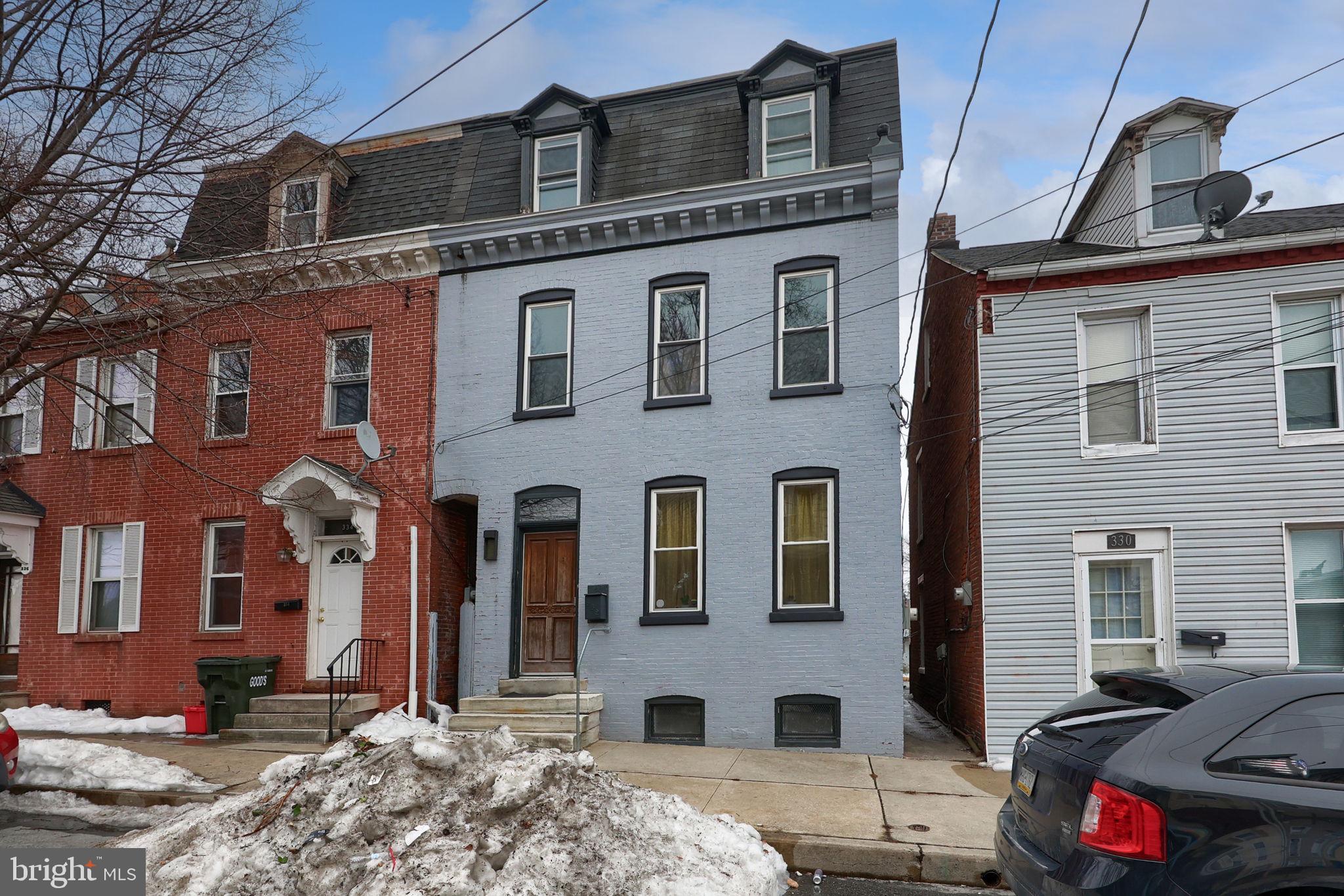 332 Perry Street Columbia, PA 17512 - Photo 37 of 37 a front view of a house with cars parked