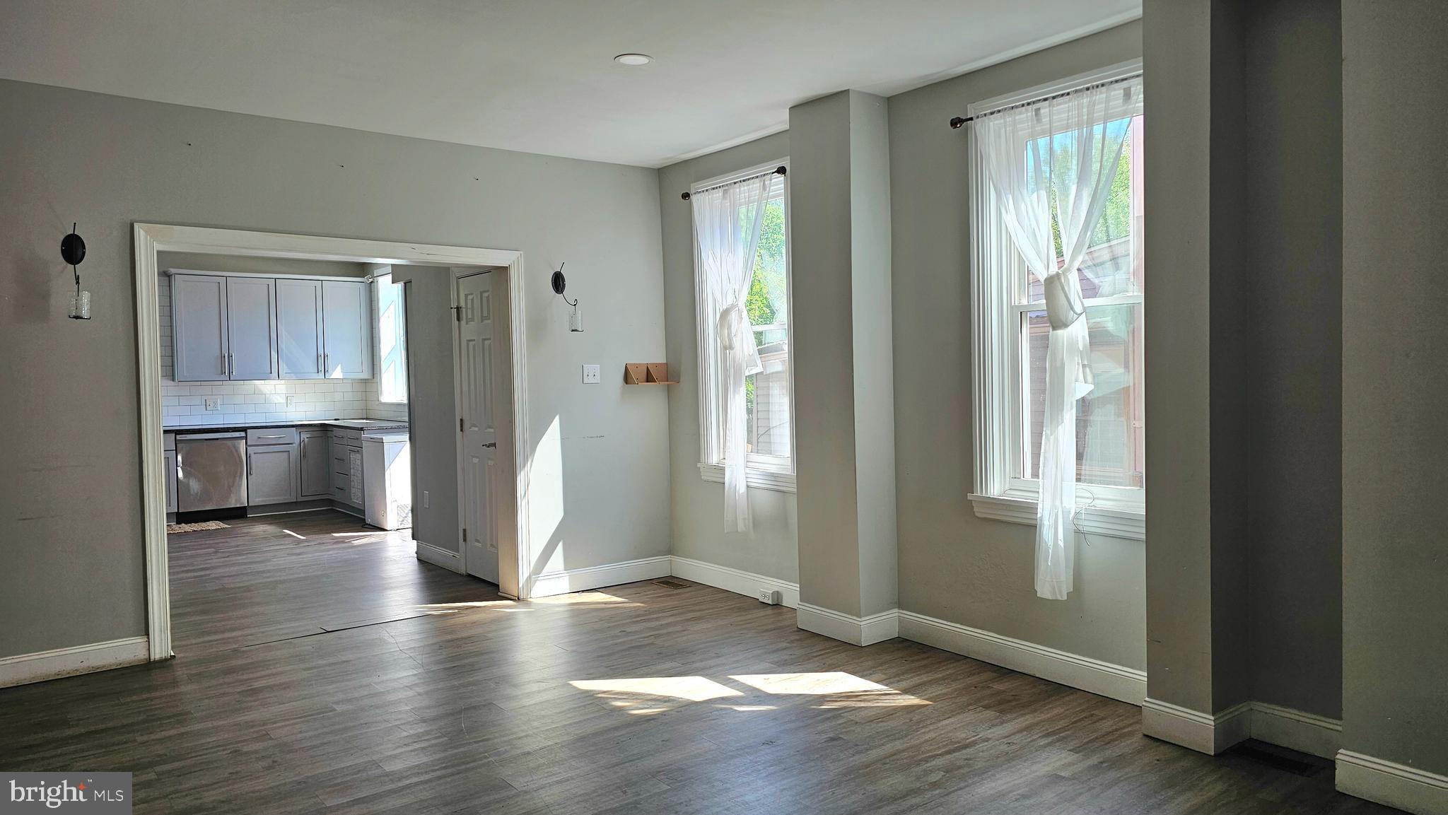 332 Perry Street Columbia, PA 17512 - Photo 4 of 31 wooden floor in an empty room with a window