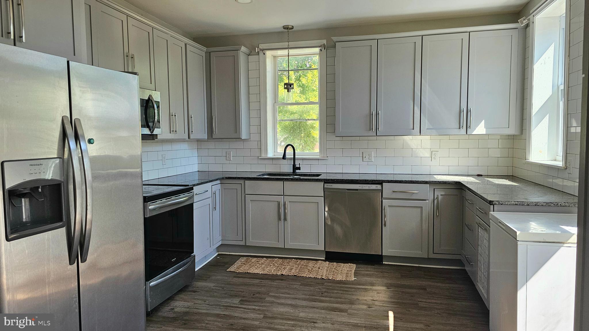332 Perry Street Columbia, PA 17512 - Photo 6 of 31 a kitchen with granite countertop a sink stainless steel appliances and cabinets