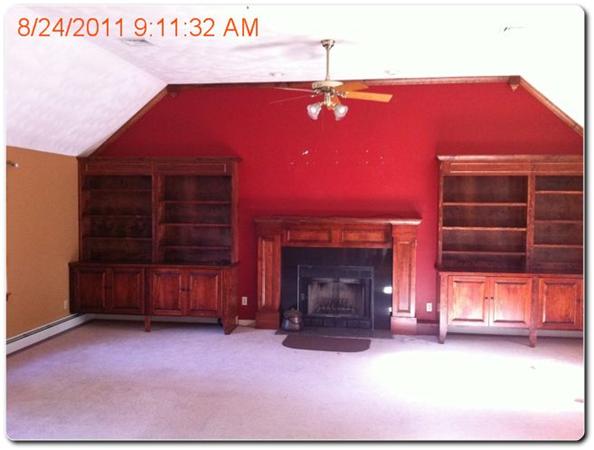 664 Boxford Road Haverhill, MA 01835 - Photo 3 of 10 a view of a livingroom with furniture and a fireplace