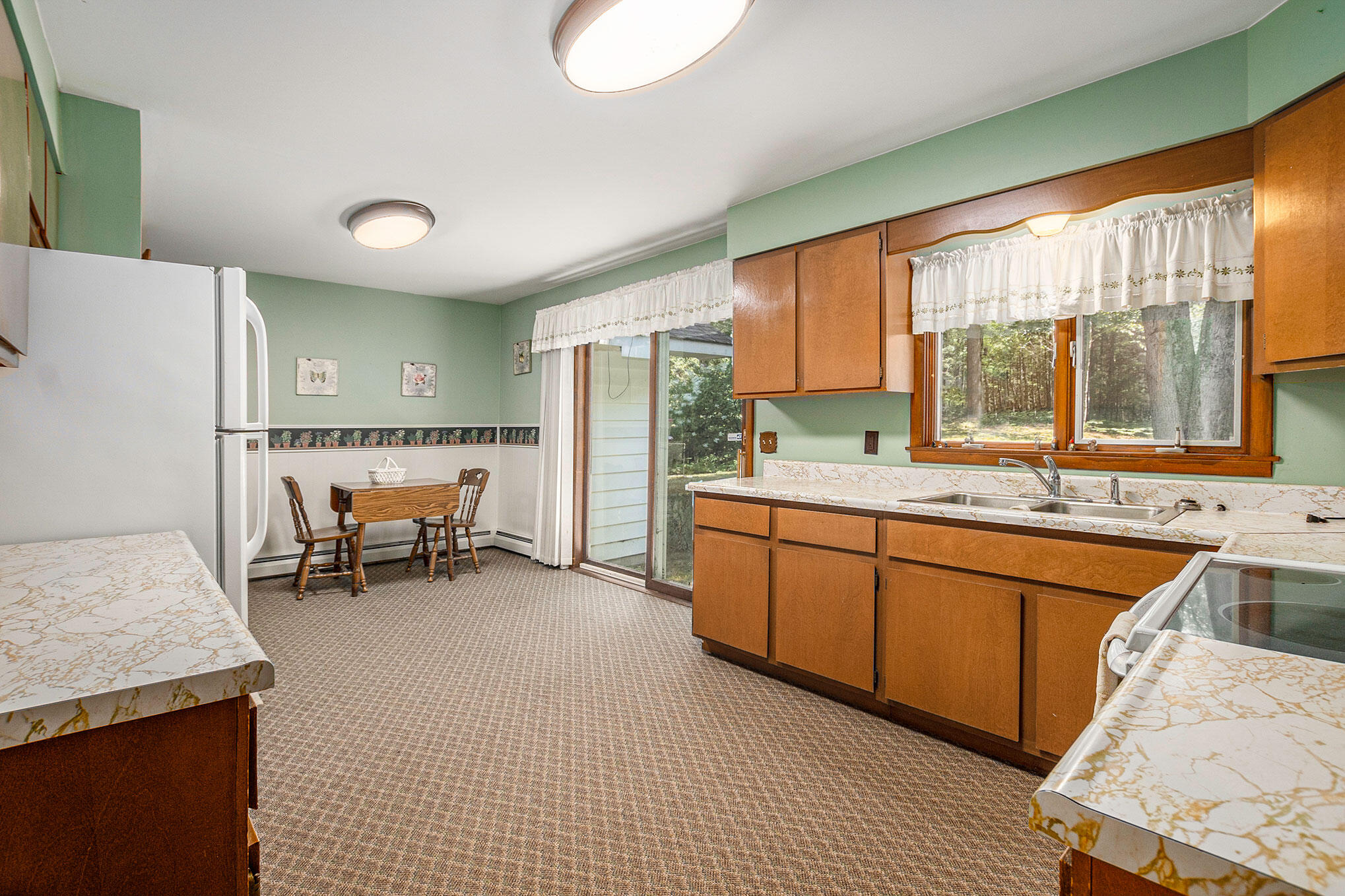 5291 West Angling Road Ludington, MI 49431 - Photo 8 of 37 kitchen and dining area