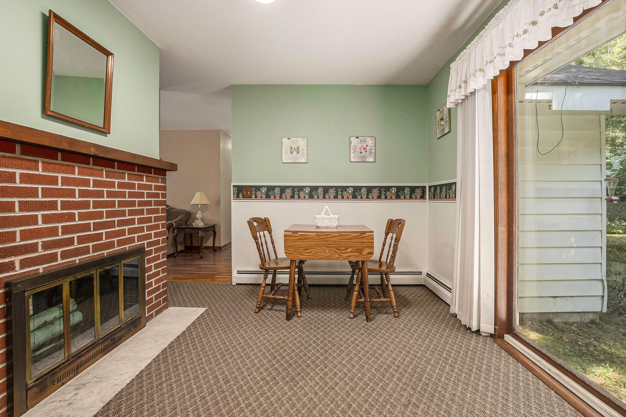 5291 West Angling Road Ludington, MI 49431 - Photo 10 of 37 Fireplace on kitchen side