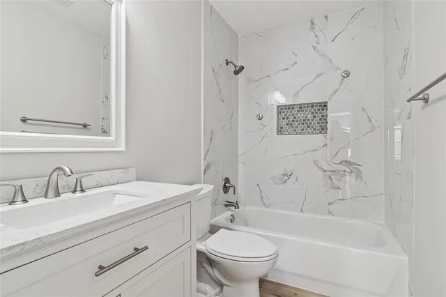 a bathroom with a sink a toilet and a bathtub