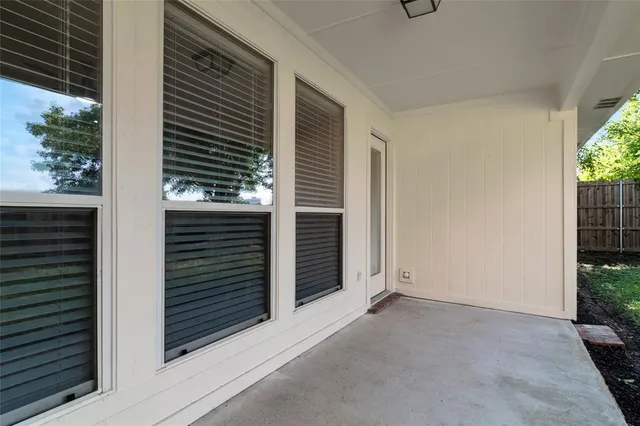 a view of front door and yard of the house