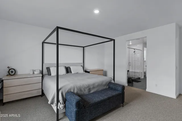 a bedroom with a bed and a cabinets