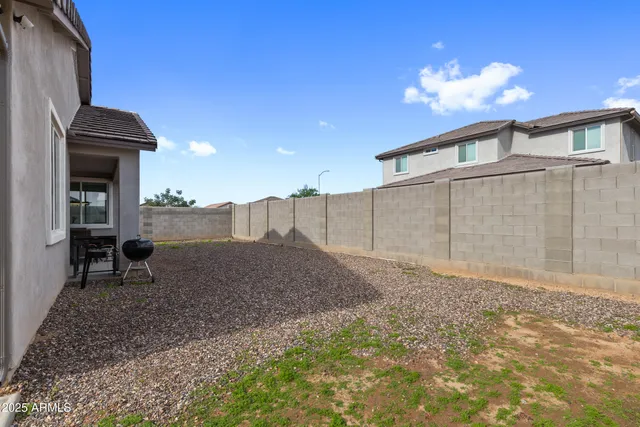 a house view with a backyard space