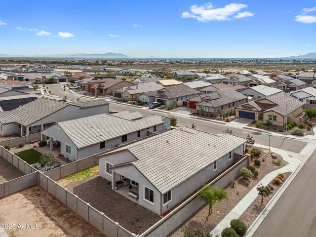 an aerial view of a residential apartment building in front of a city