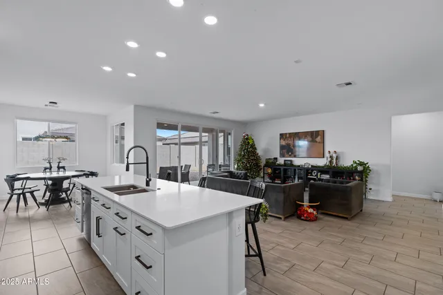 a kitchen with sink stove and cabinets
