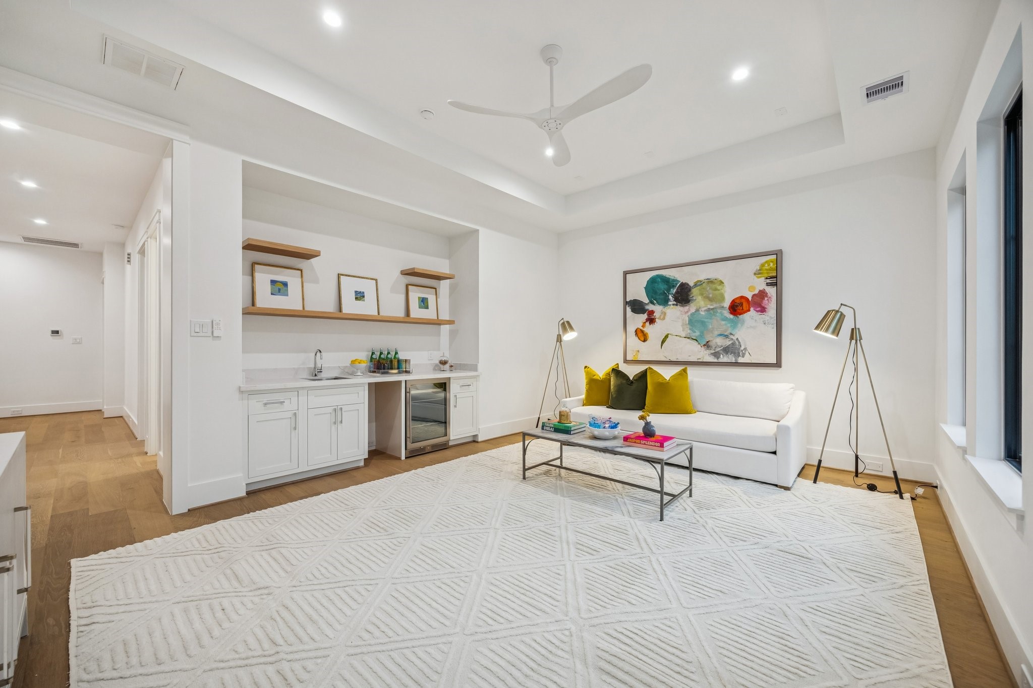 1204 West Drew Street Houston, TX 77006 - Photo 26 of 32 Upstairs media room with 7 1/2 Inch Wide Plank, European White Oak Floors, Coffered Ceiling and a MinkaAire Roto XL 62" 3 Blade Ceiling Fan.