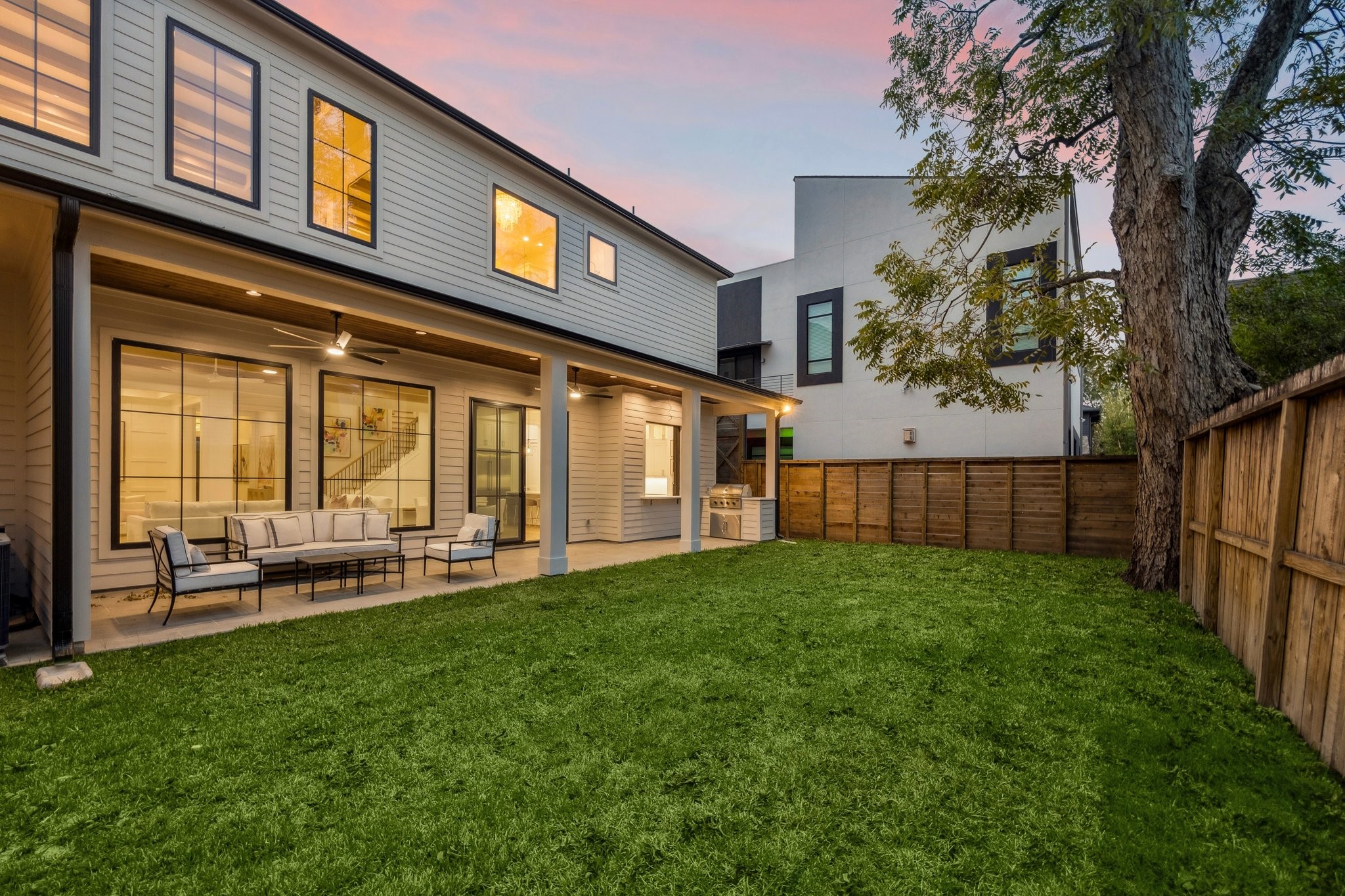 1204 West Drew Street Houston, TX 77006 - Photo 31 of 32 Evening view of the back of the home. The yard has plenty of room for a pool!