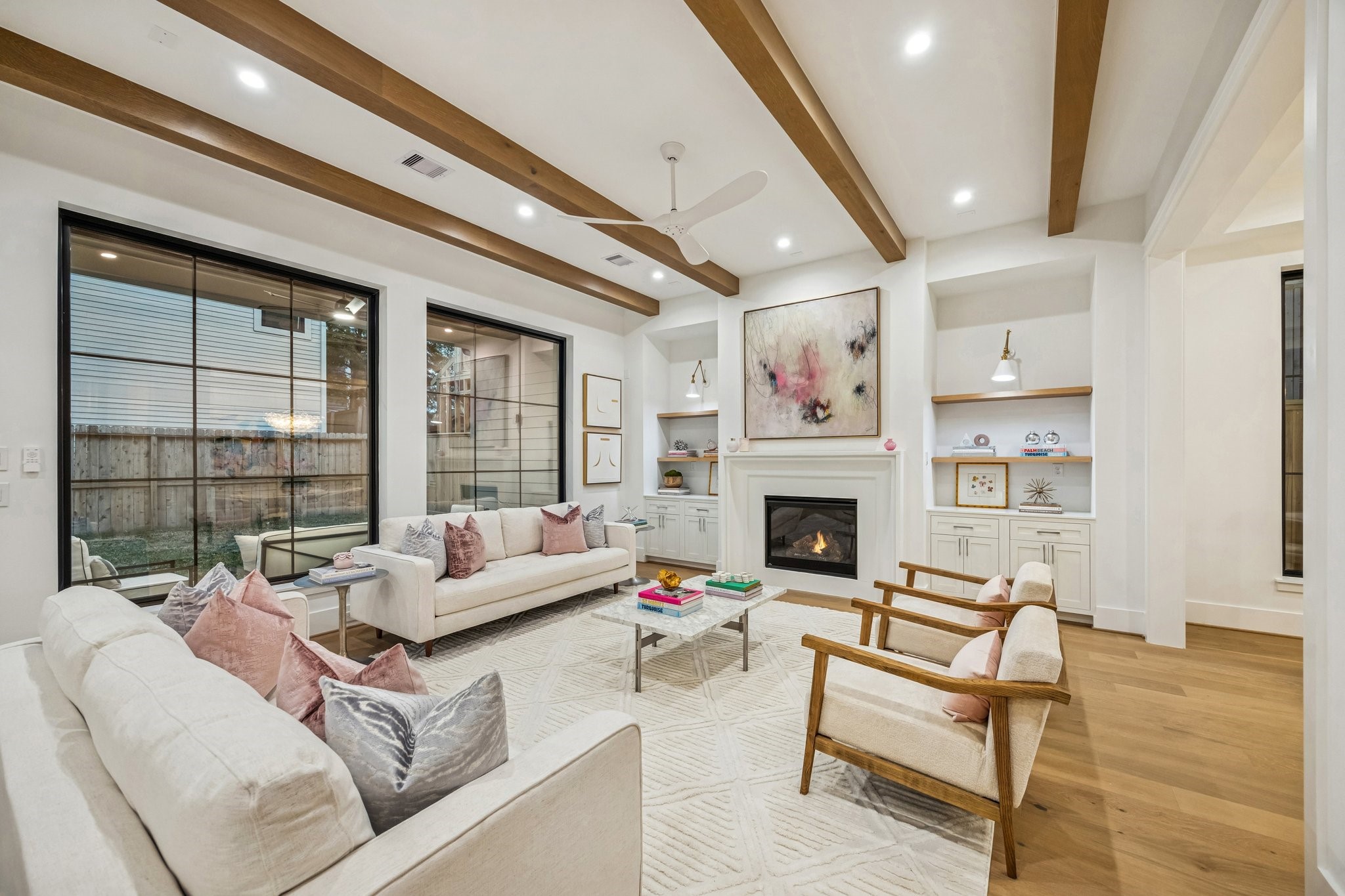 1204 West Drew Street Houston, TX 77006 - Photo 9 of 32 Wow! What a beautiful Family Room with a wall of windows, stained oak boxed beams and a MinkaAire Roto XL 62" 3 Blade Ceiling Fan.