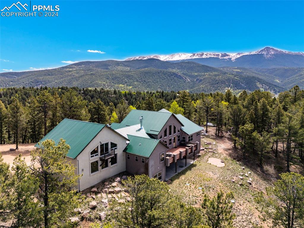 252 Running Elk Point Divide, CO 80814 - Photo 1 of 48 an aerial view of a house with a mountain in the background