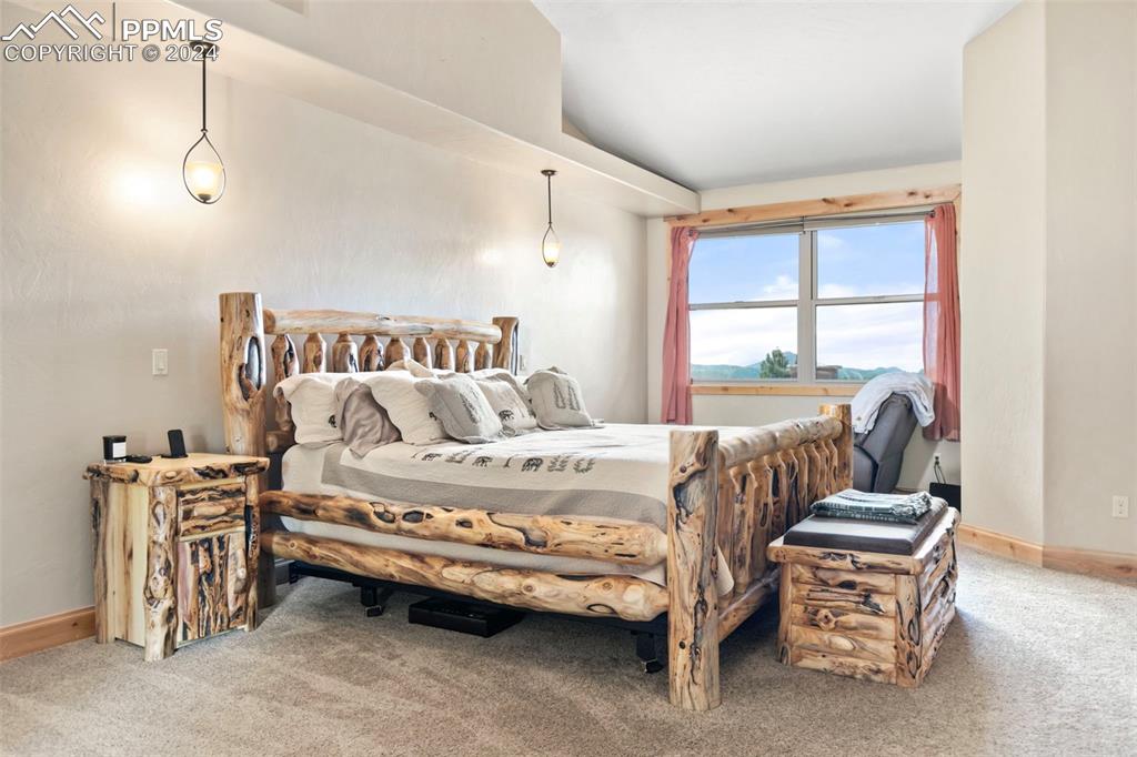 252 Running Elk Point Divide, CO 80814 - Photo 17 of 48 a spacious bedroom with a bed and a window