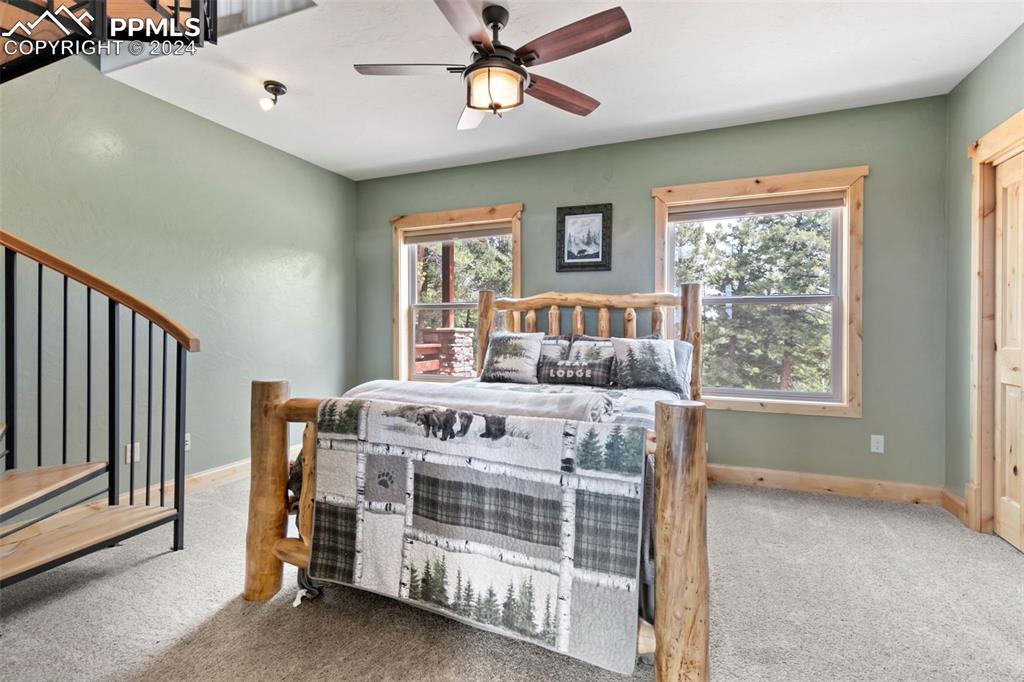 252 Running Elk Point Divide, CO 80814 - Photo 20 of 48 a bedroom with a bed and a window