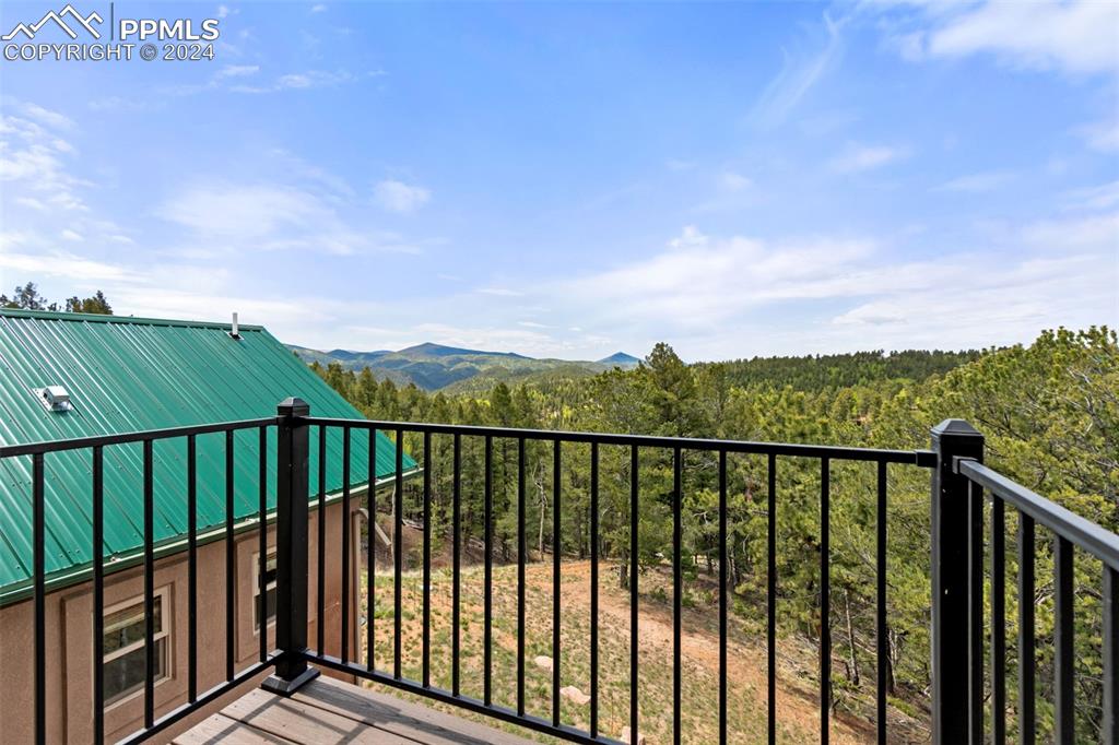 252 Running Elk Point Divide, CO 80814 - Photo 32 of 48 a view of a balcony with wooden floor & fence