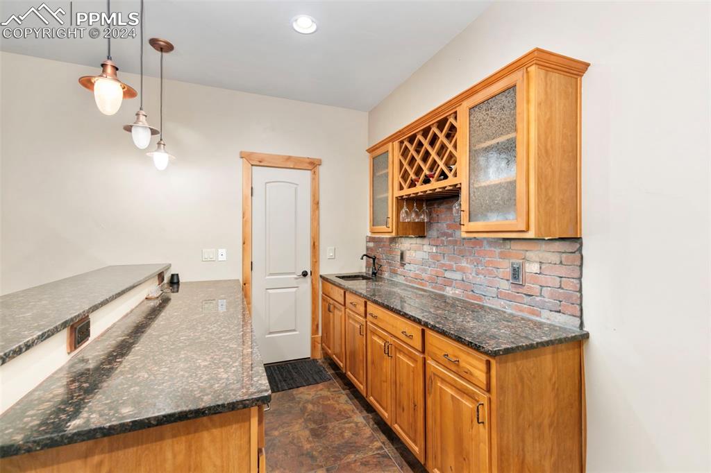 252 Running Elk Point Divide, CO 80814 - Photo 35 of 48 a bathroom with a granite countertop sink and a mirror