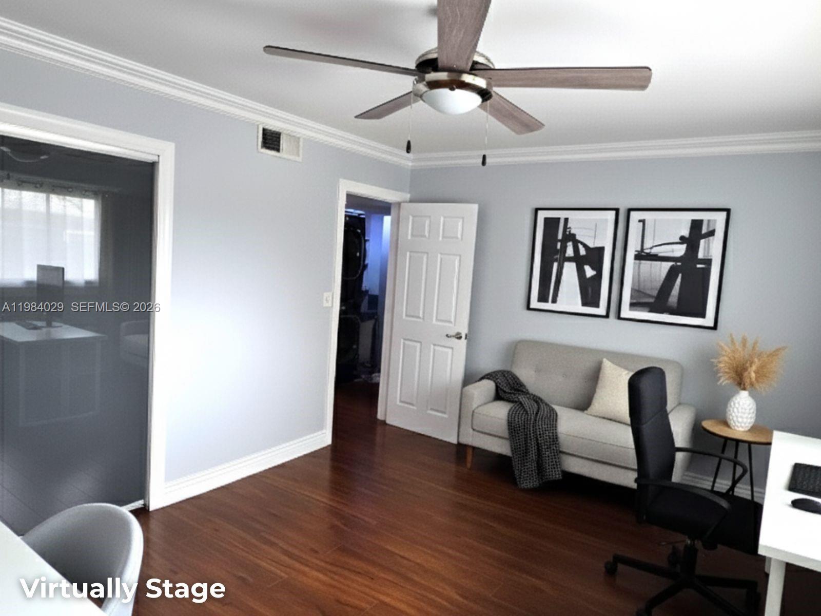 3282 North Pine Island Road, Unit 301 Sunrise, FL 33351 - Photo 12 of 22 a living room with furniture and a painting on the wall