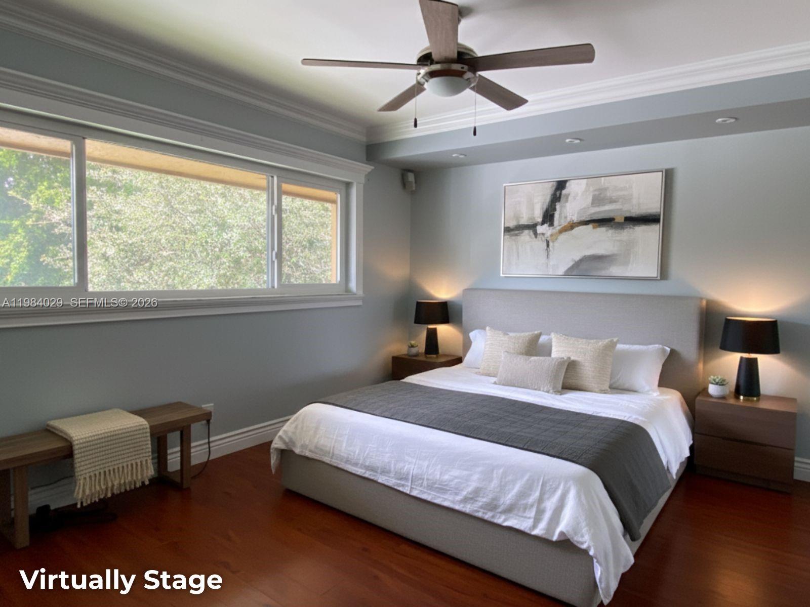 3282 North Pine Island Road, Unit 301 Sunrise, FL 33351 - Photo 19 of 22 a bedroom with a bed a couch and a window