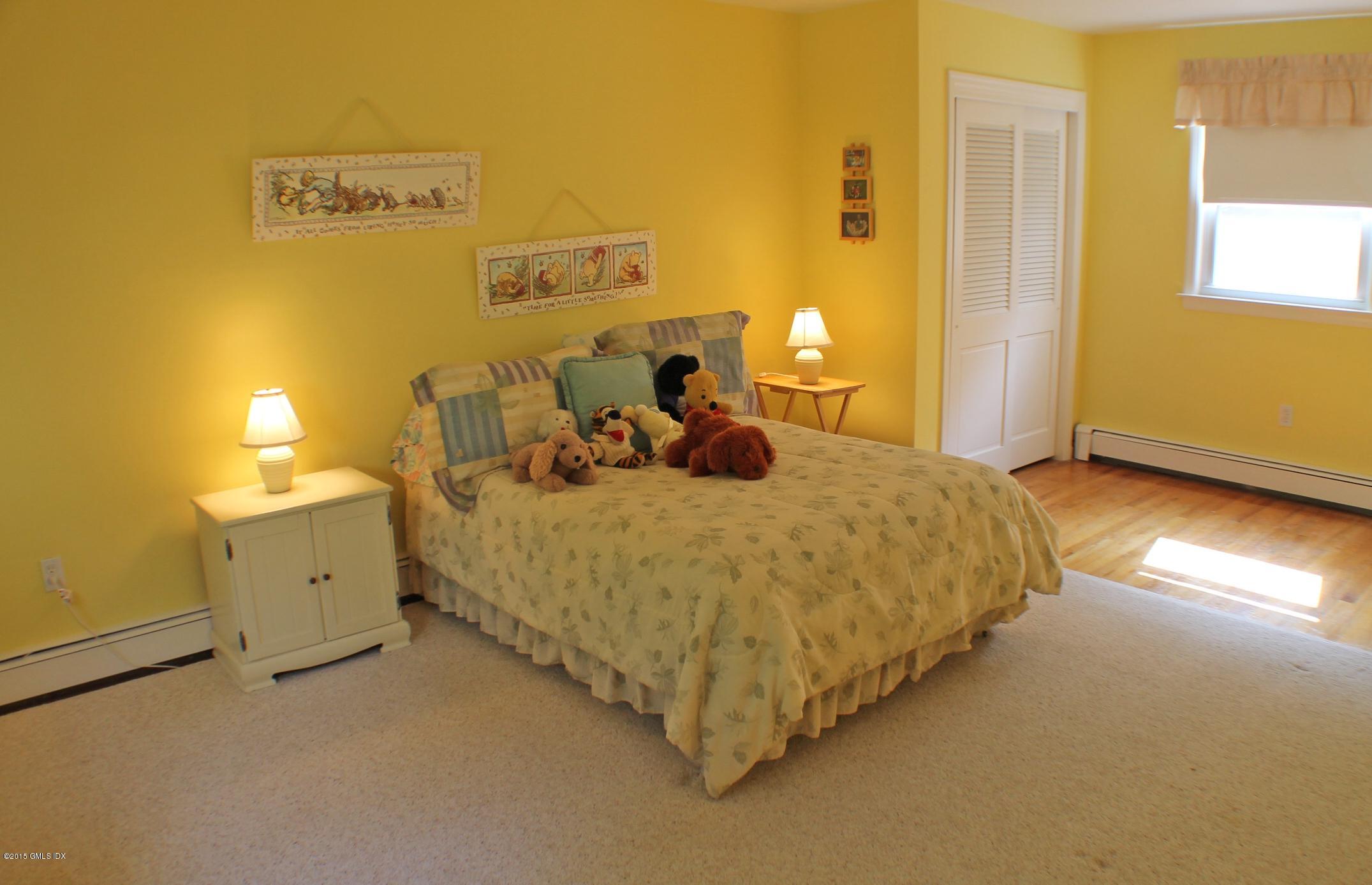 237 Chestnut Hill Road Stamford, CT 06903 - Photo 12 of 18 a bed room with a bed and a table