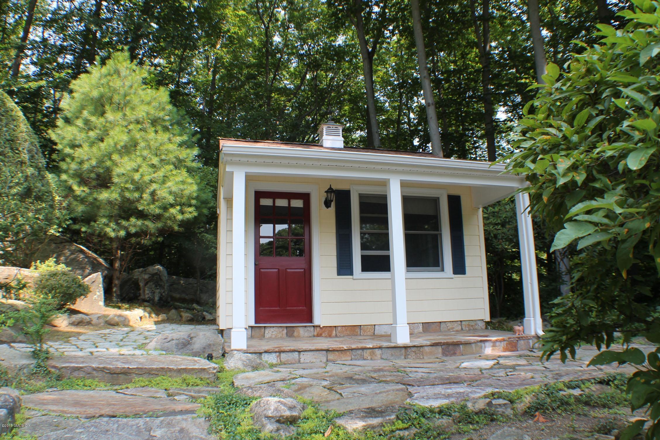 237 Chestnut Hill Road Stamford, CT 06903 - Photo 14 of 18 a front view of a house with garden
