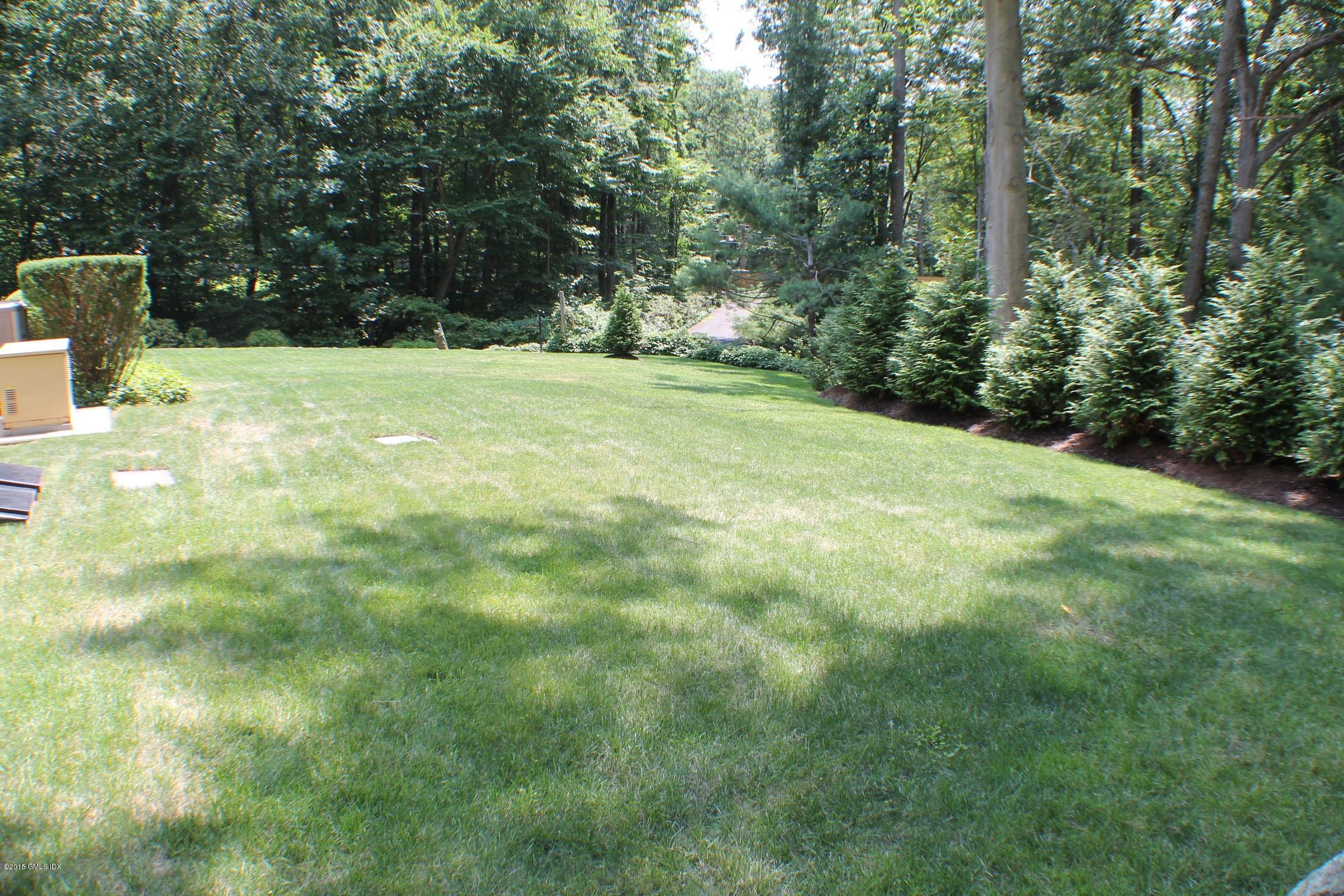 237 Chestnut Hill Road Stamford, CT 06903 - Photo 18 of 18 a view of outdoor space with a garden and trees