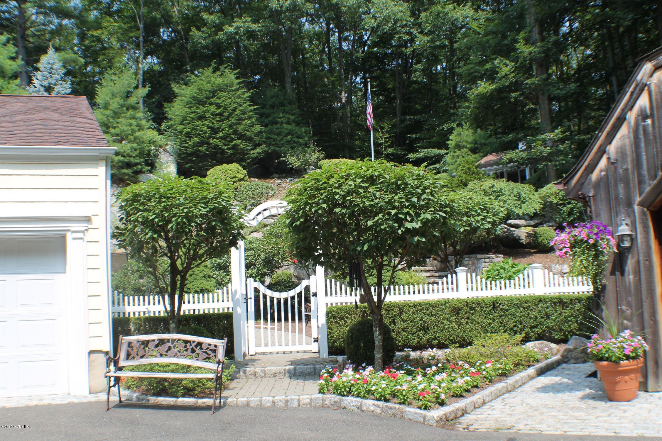 237 Chestnut Hill Road Stamford, CT 06903 - Photo 3 of 18 a house view with a garden space