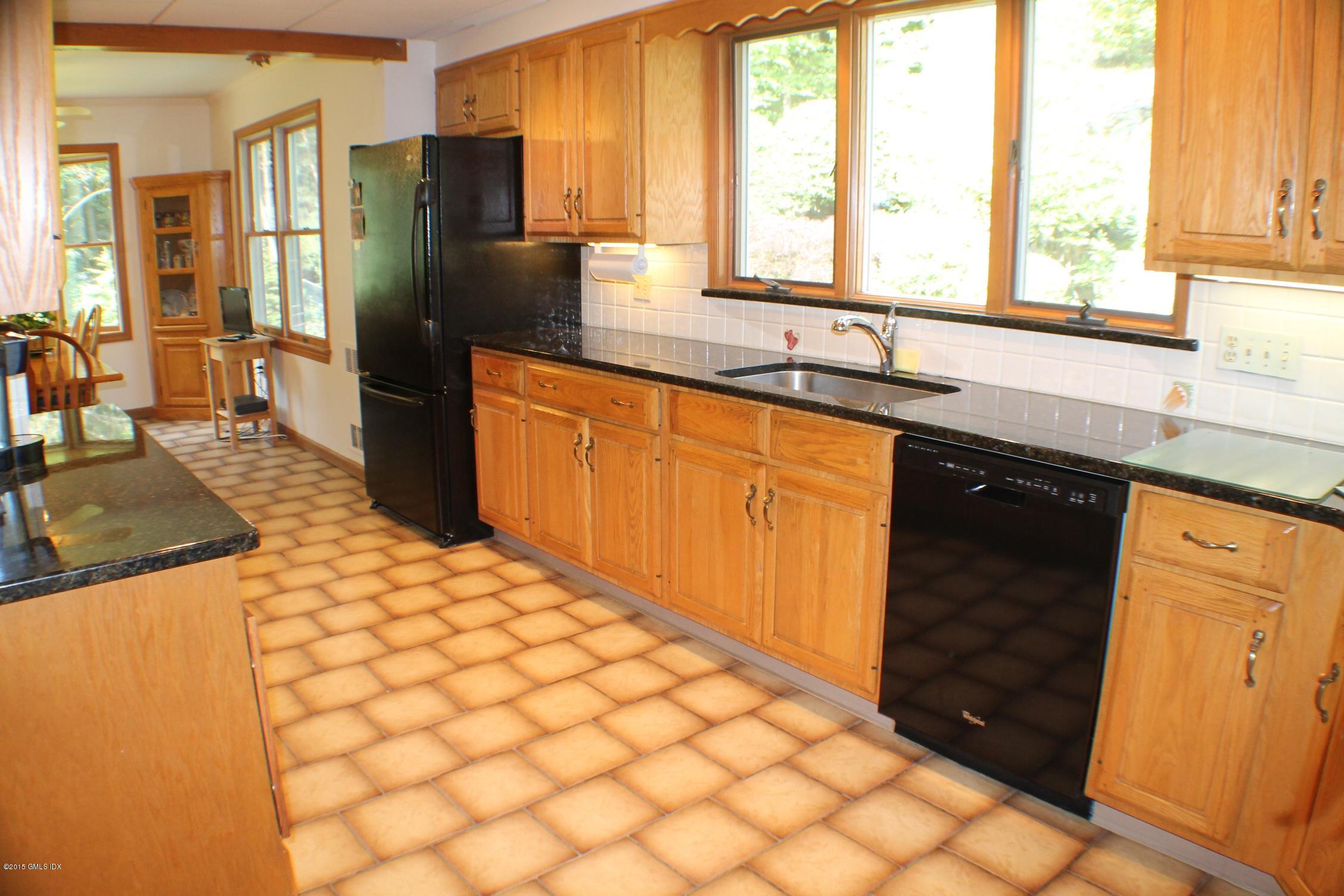237 Chestnut Hill Road Stamford, CT 06903 - Photo 6 of 18 a kitchen with stainless steel appliances granite countertop a refrigerator and a sink