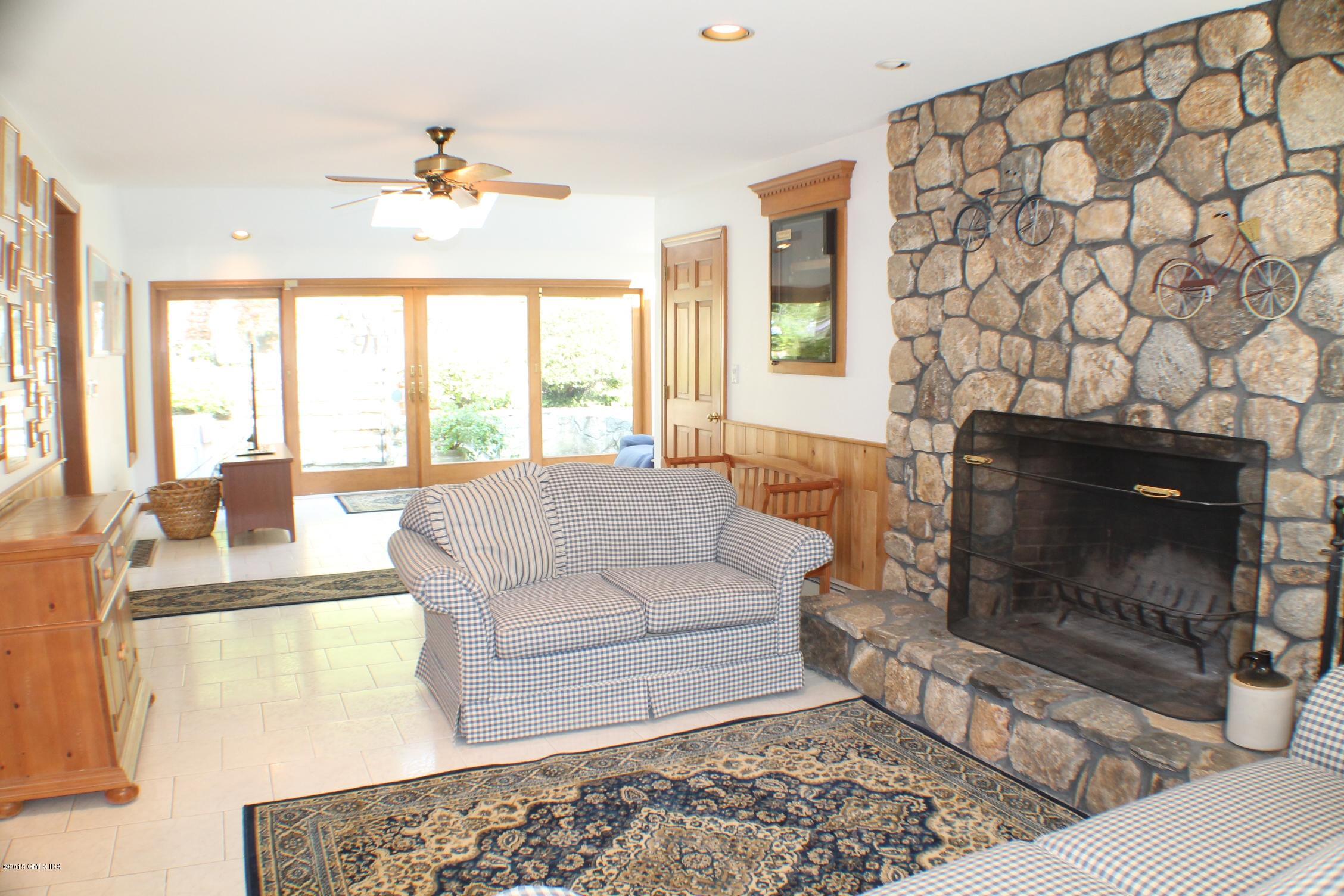 237 Chestnut Hill Road Stamford, CT 06903 - Photo 8 of 18 a living room with furniture and a fireplace