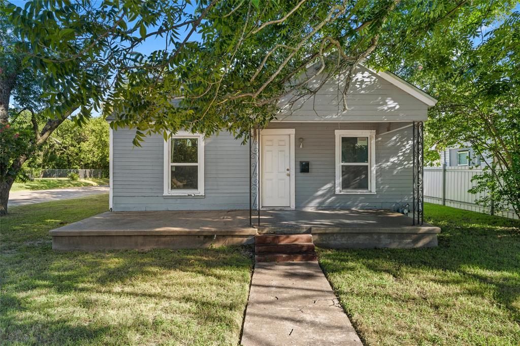 2225 Mitchell Avenue Waco, TX 76708 - Photo 1 of 16 Single-story residence featuring light gray siding, white trim, and a covered front porch