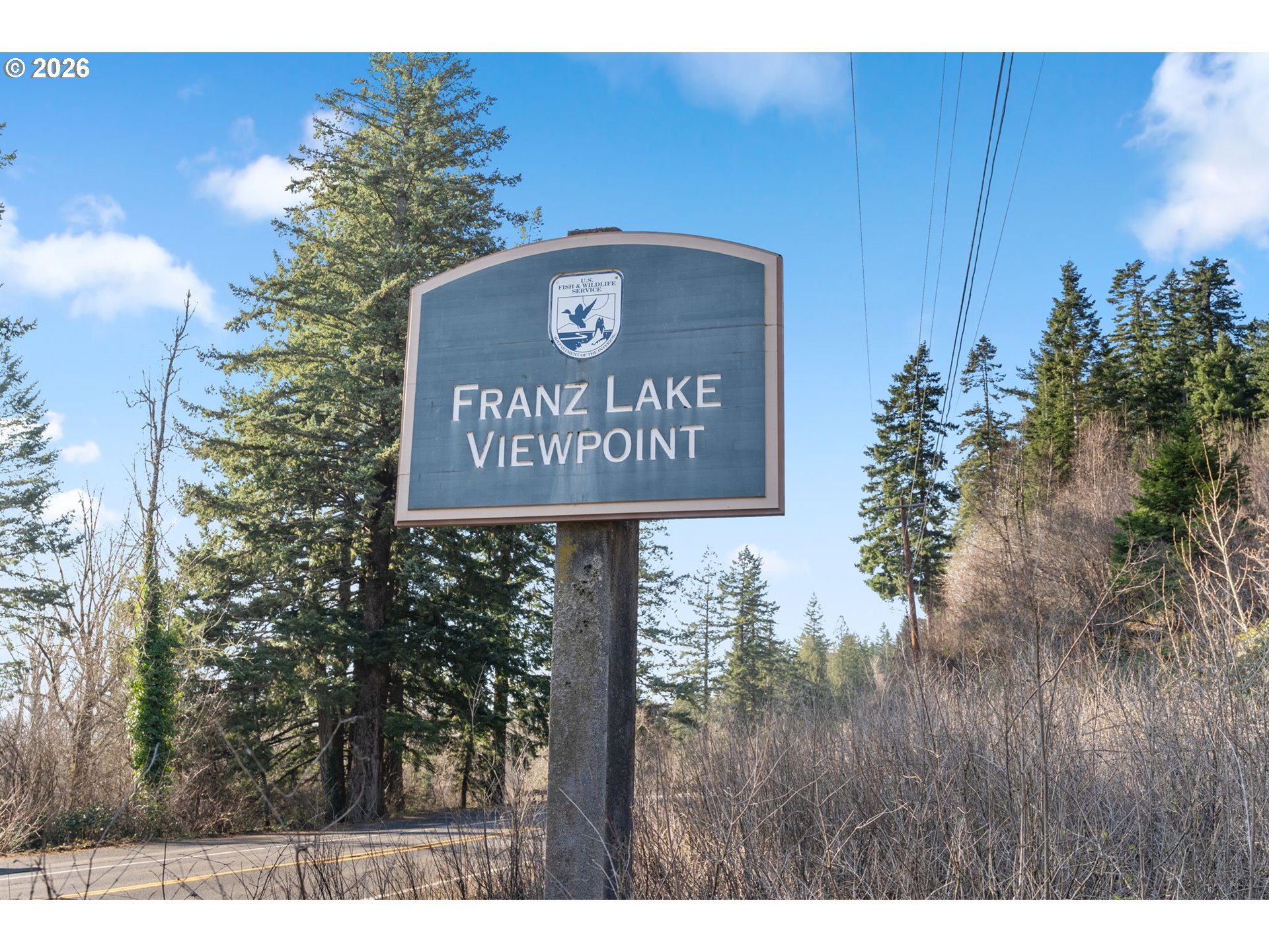 831 Franz Road Stevenson, WA 98648 - Photo 20 of 26 a sign broad in front of the red white house