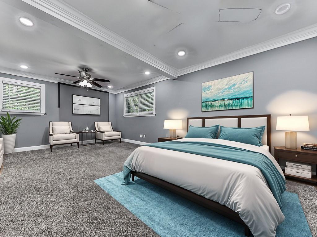 1564 Bubbling Creek Road Northeast Brookhaven, GA 30319 - Photo 19 of 34 a spacious bedroom with a bed and furniture