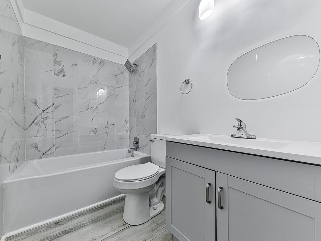 1564 Bubbling Creek Road Northeast Brookhaven, GA 30319 - Photo 25 of 34 a bathroom with a sink a toilet and shower
