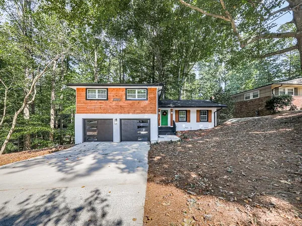 a front view of a house with yard