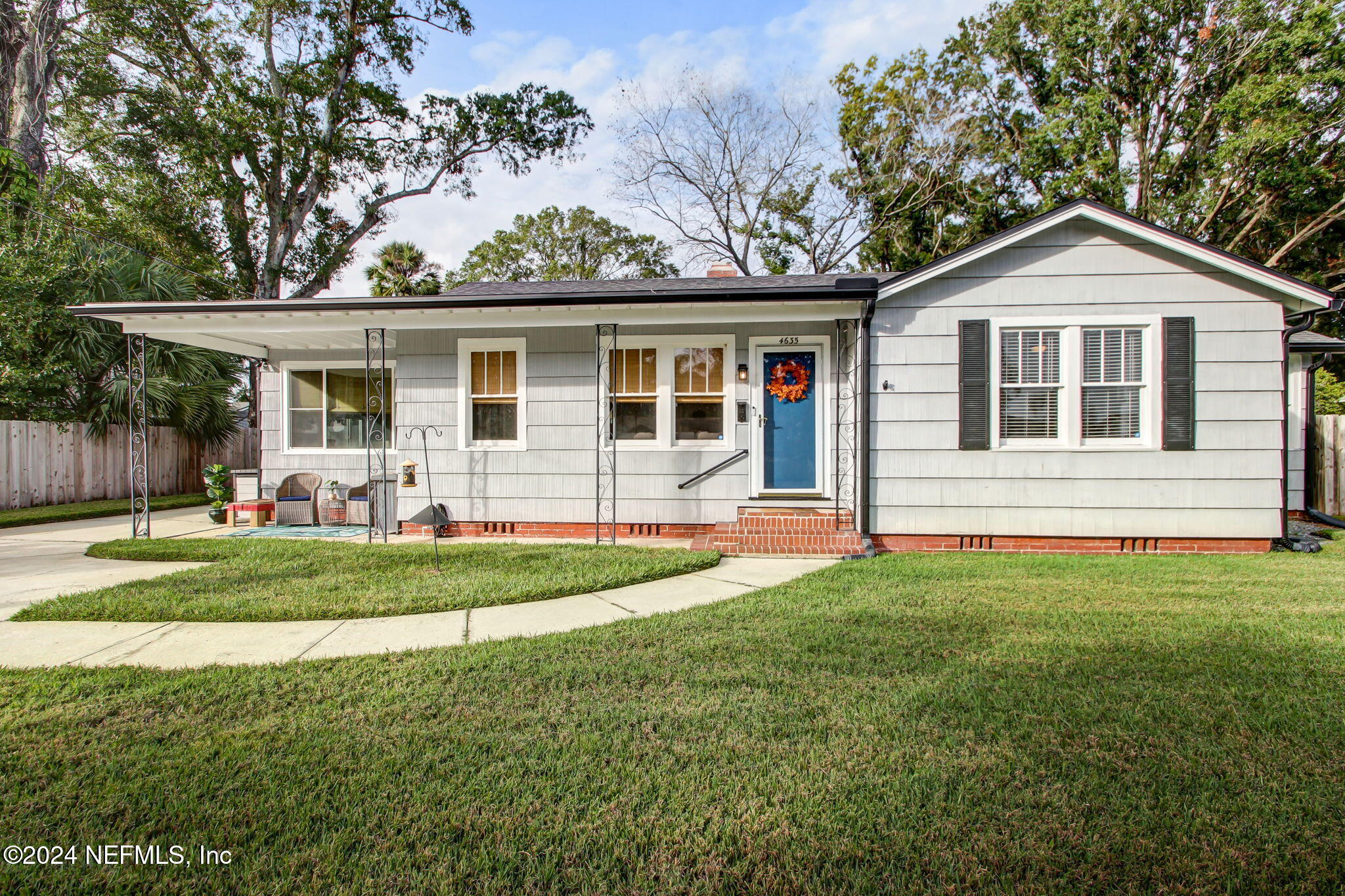 4635 Colonial Avenue Jacksonville, FL 32210 - Photo 2 of 42 a front view of a house with a yard