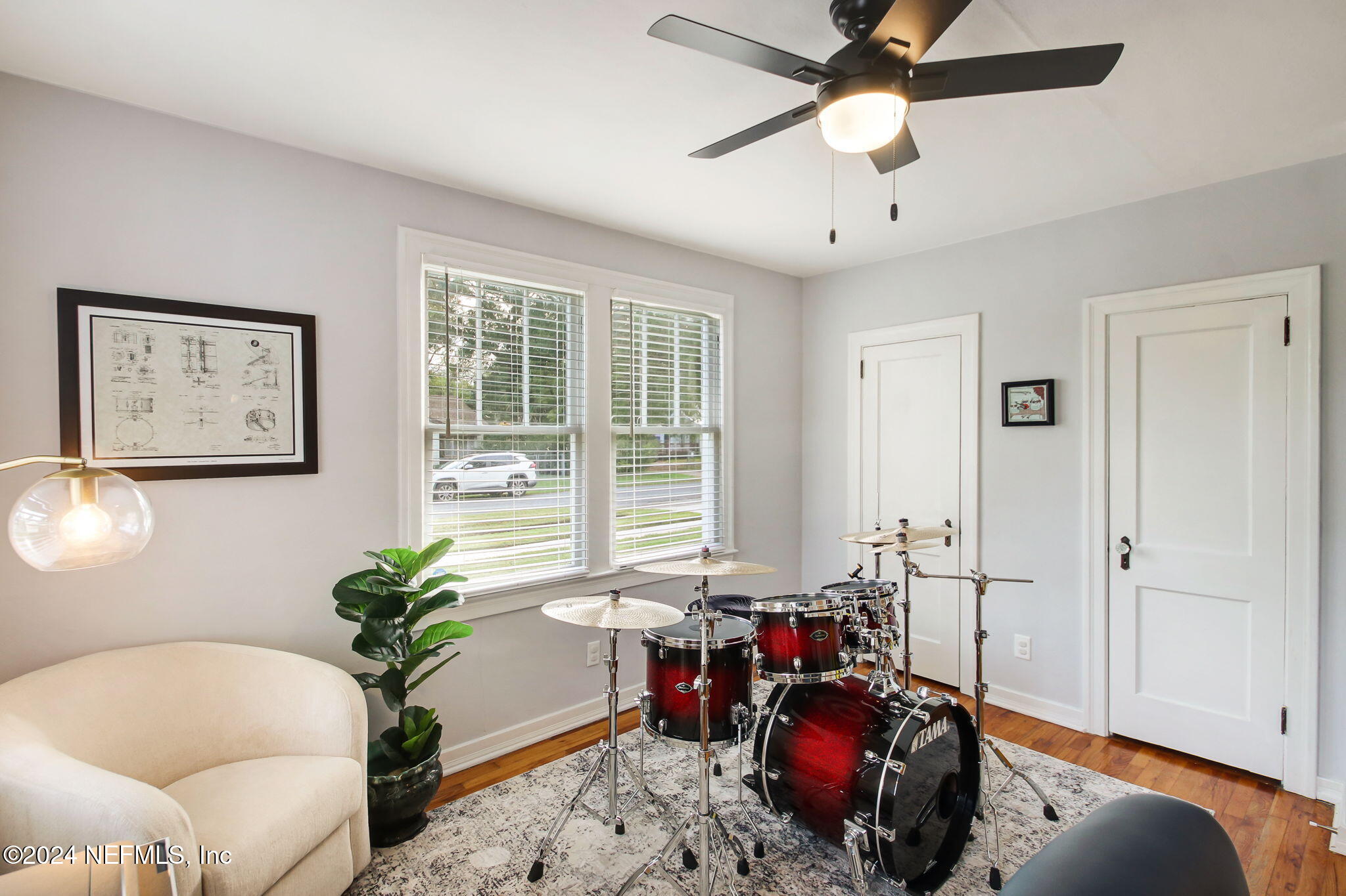 4635 Colonial Avenue Jacksonville, FL 32210 - Photo 30 of 42 a living room with furniture and a potted plant
