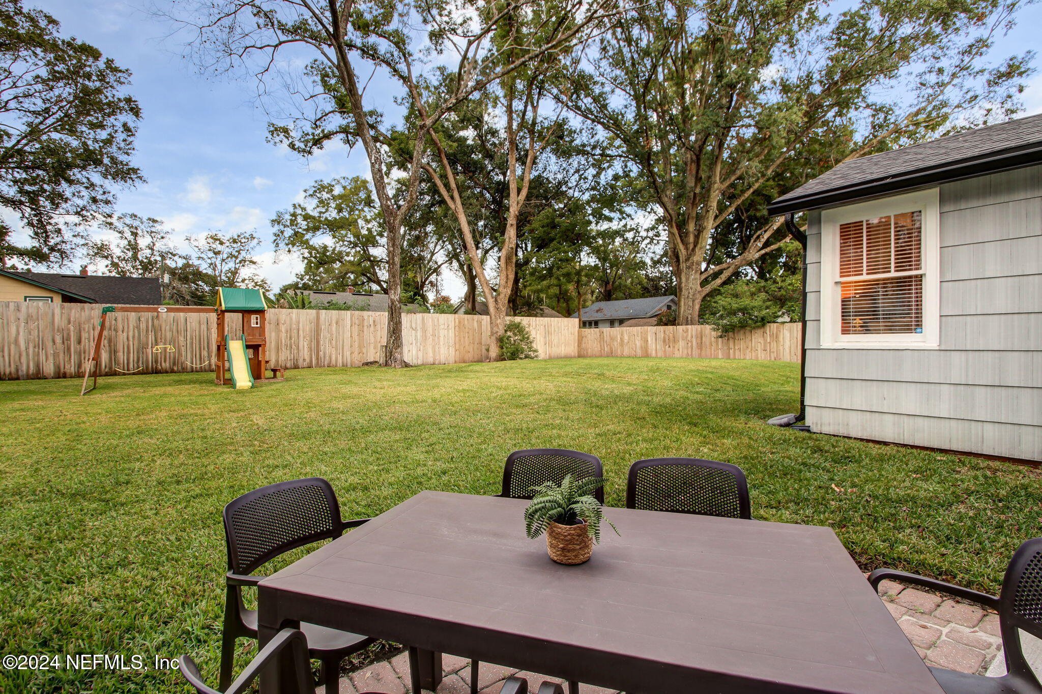 4635 Colonial Avenue Jacksonville, FL 32210 - Photo 35 of 42 a view of a house with backyard and sitting area