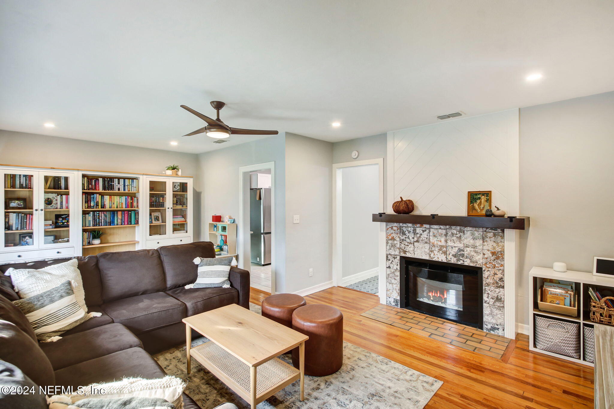 4635 Colonial Avenue Jacksonville, FL 32210 - Photo 10 of 42 a living room with furniture and a fireplace
