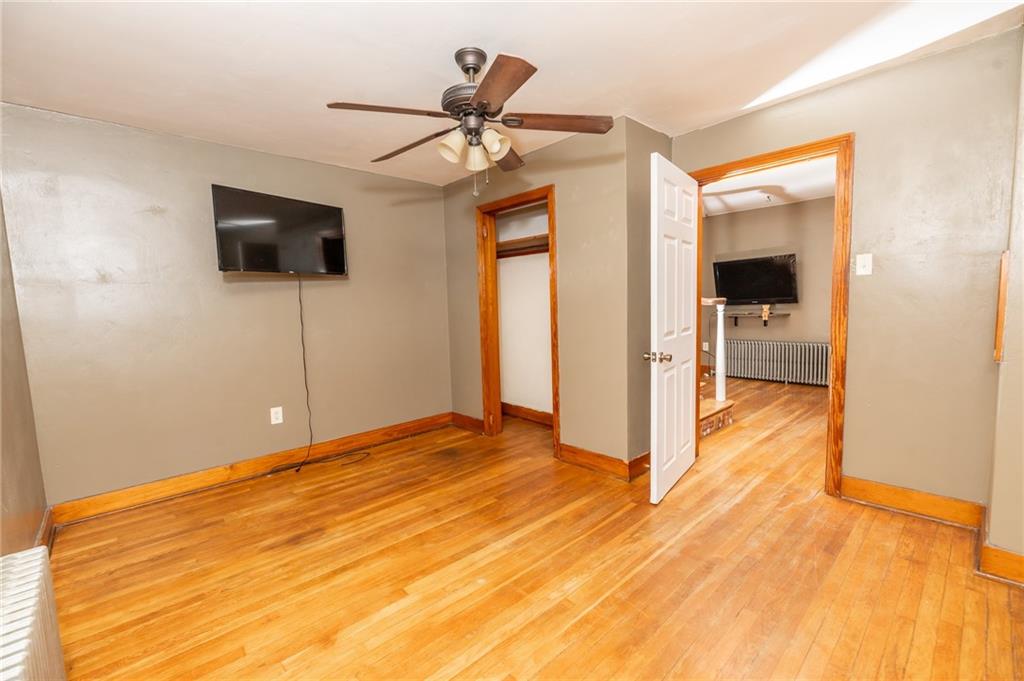 3275 Shellbark Road Armagh, PA 15920 - Photo 11 of 24 a view of empty room with wooden floor and fan