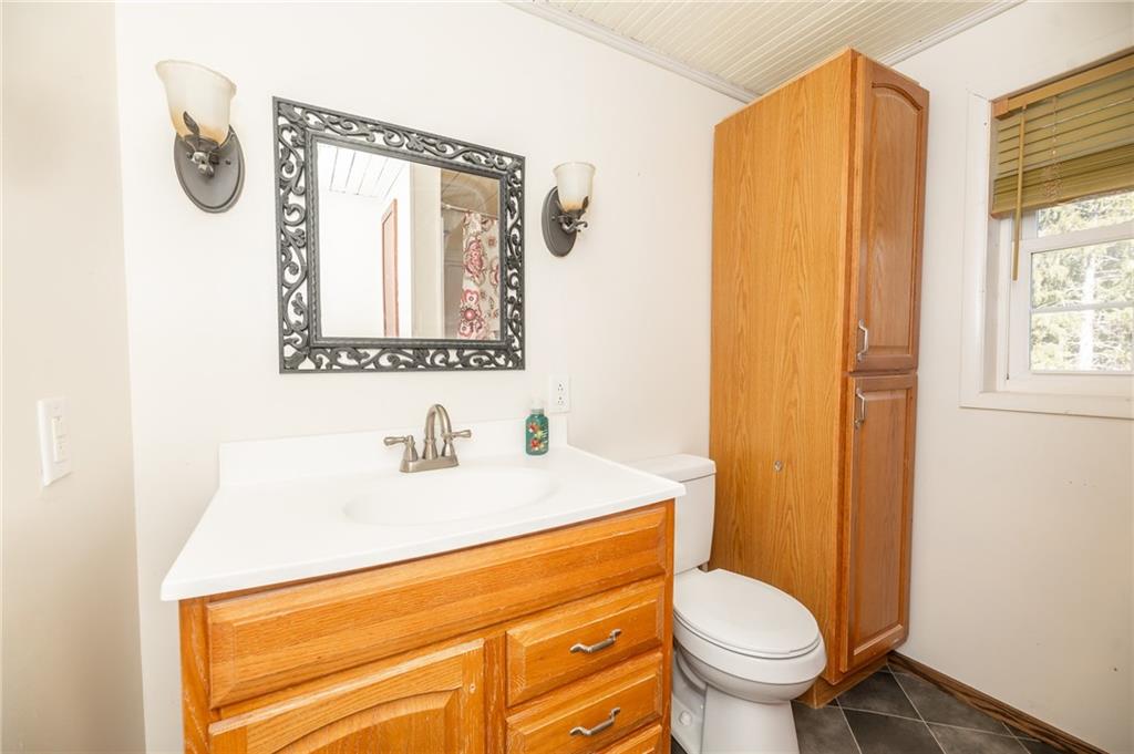 3275 Shellbark Road Armagh, PA 15920 - Photo 13 of 24 a bathroom with a sink a toilet and a mirror