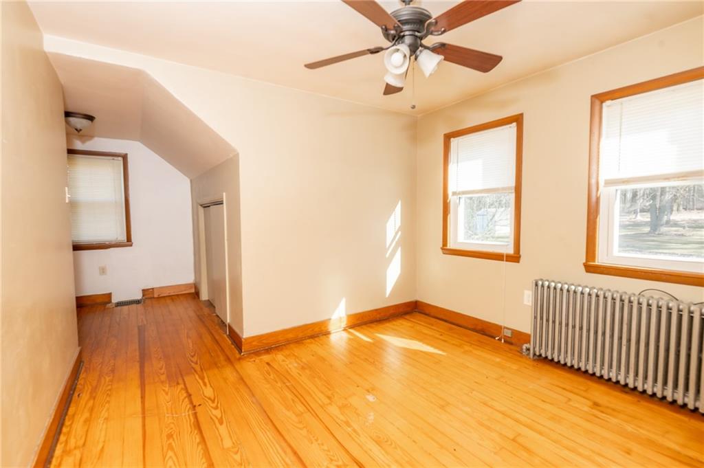 3275 Shellbark Road Armagh, PA 15920 - Photo 15 of 24 a view of a livingroom with wooden floor and a ceiling fan