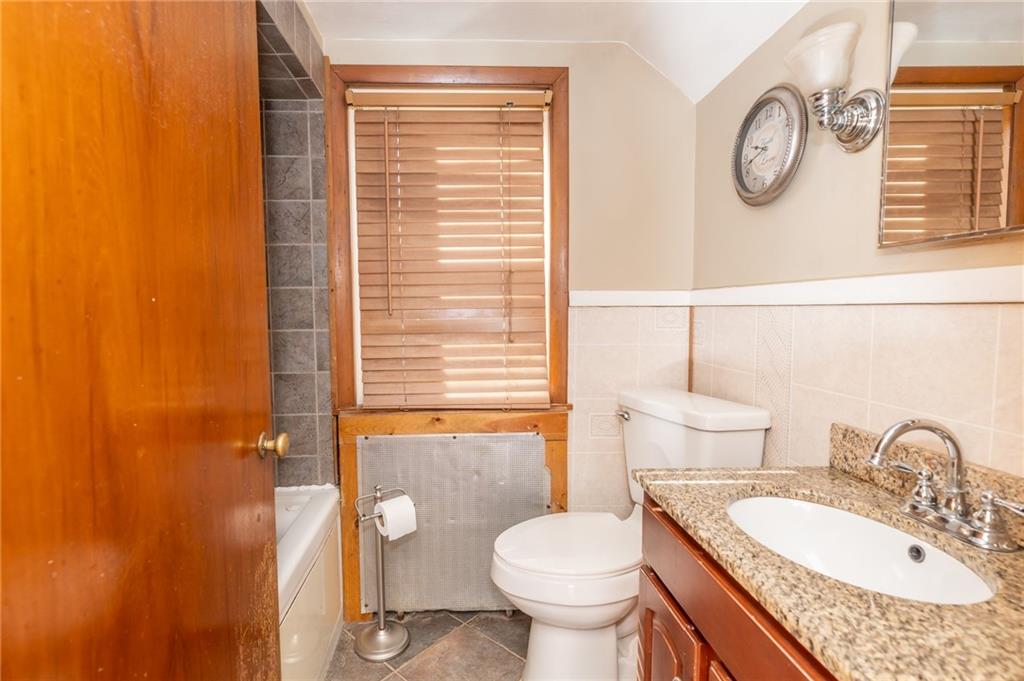3275 Shellbark Road Armagh, PA 15920 - Photo 18 of 24 a bathroom with a granite countertop toilet sink and mirror