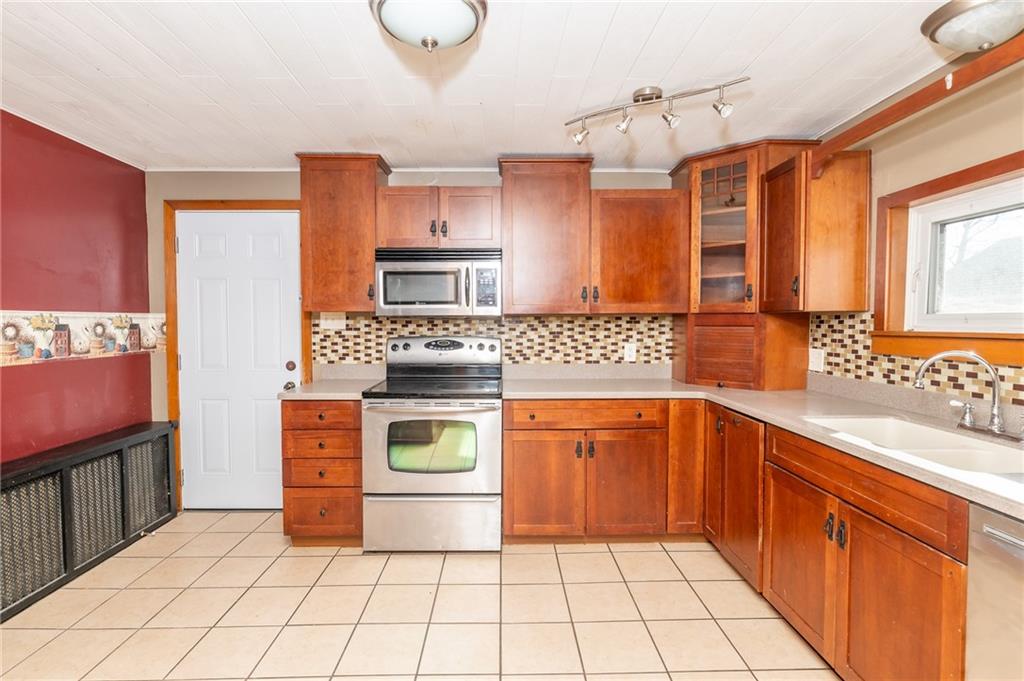 3275 Shellbark Road Armagh, PA 15920 - Photo 10 of 24 a kitchen with stainless steel appliances a sink cabinets and a window