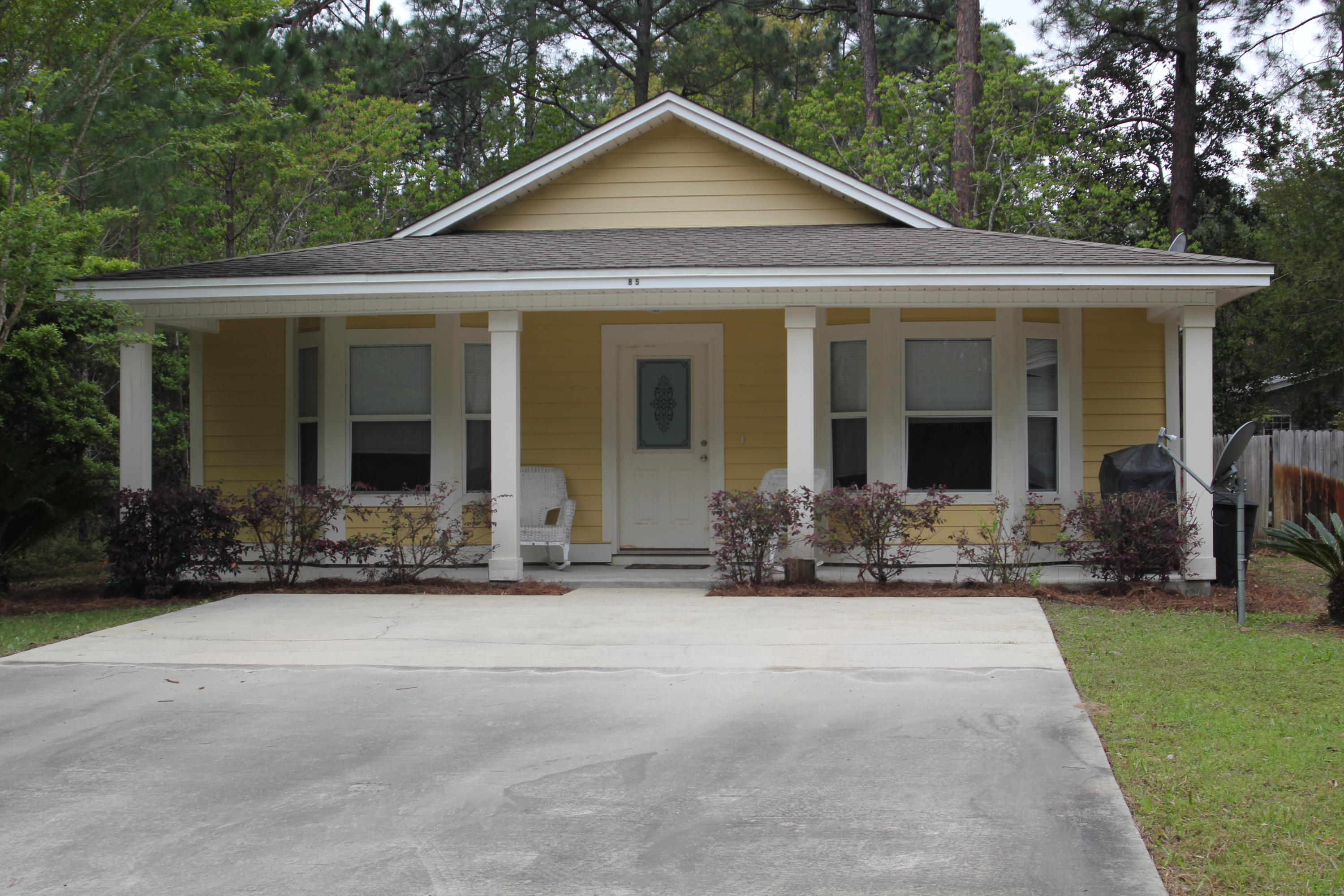 front view of a house with a yard