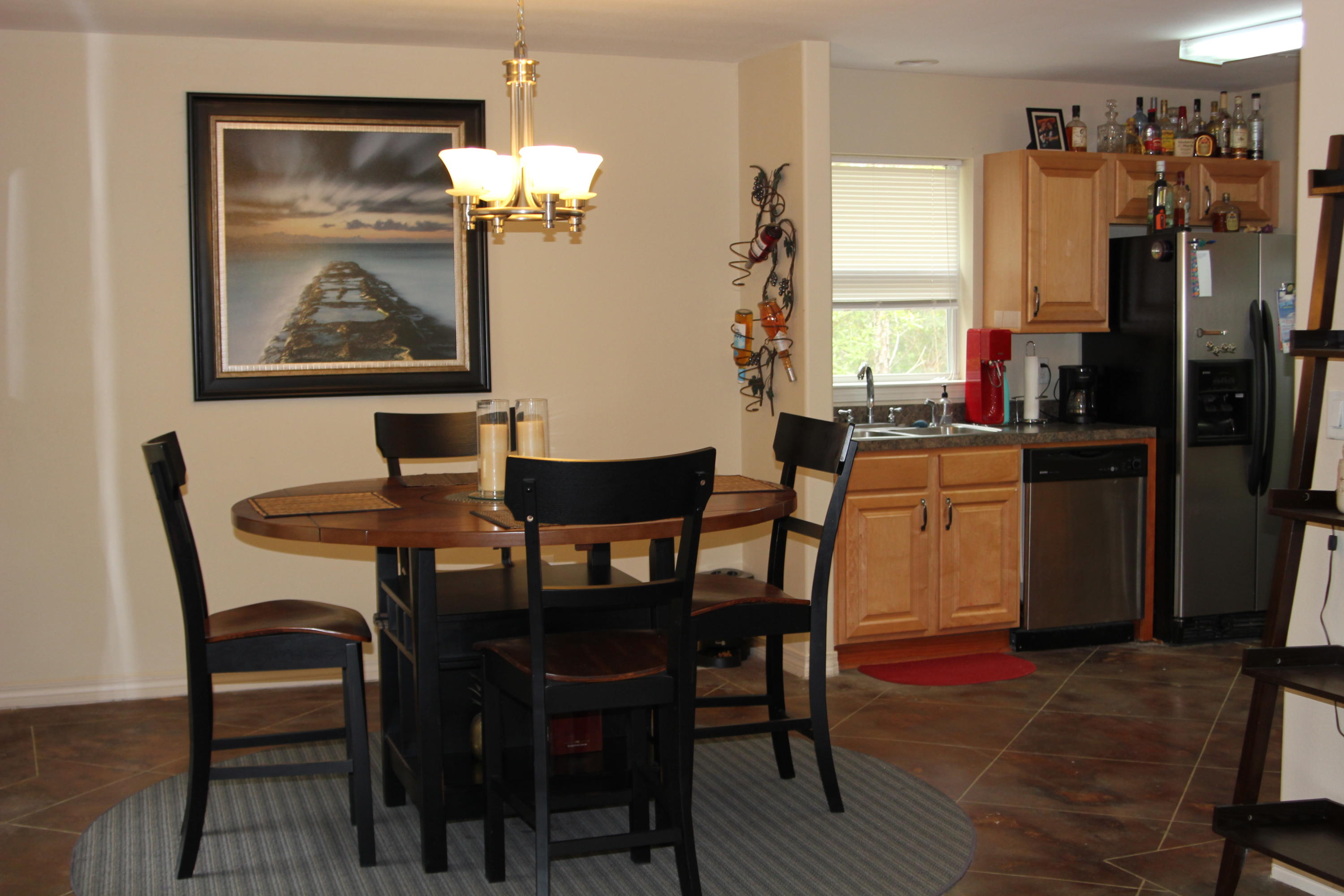 85 Indian Woman Road Santa Rosa Beach, FL 32459 - Photo 11 of 44 a dining room with furniture a rug and wooden floor