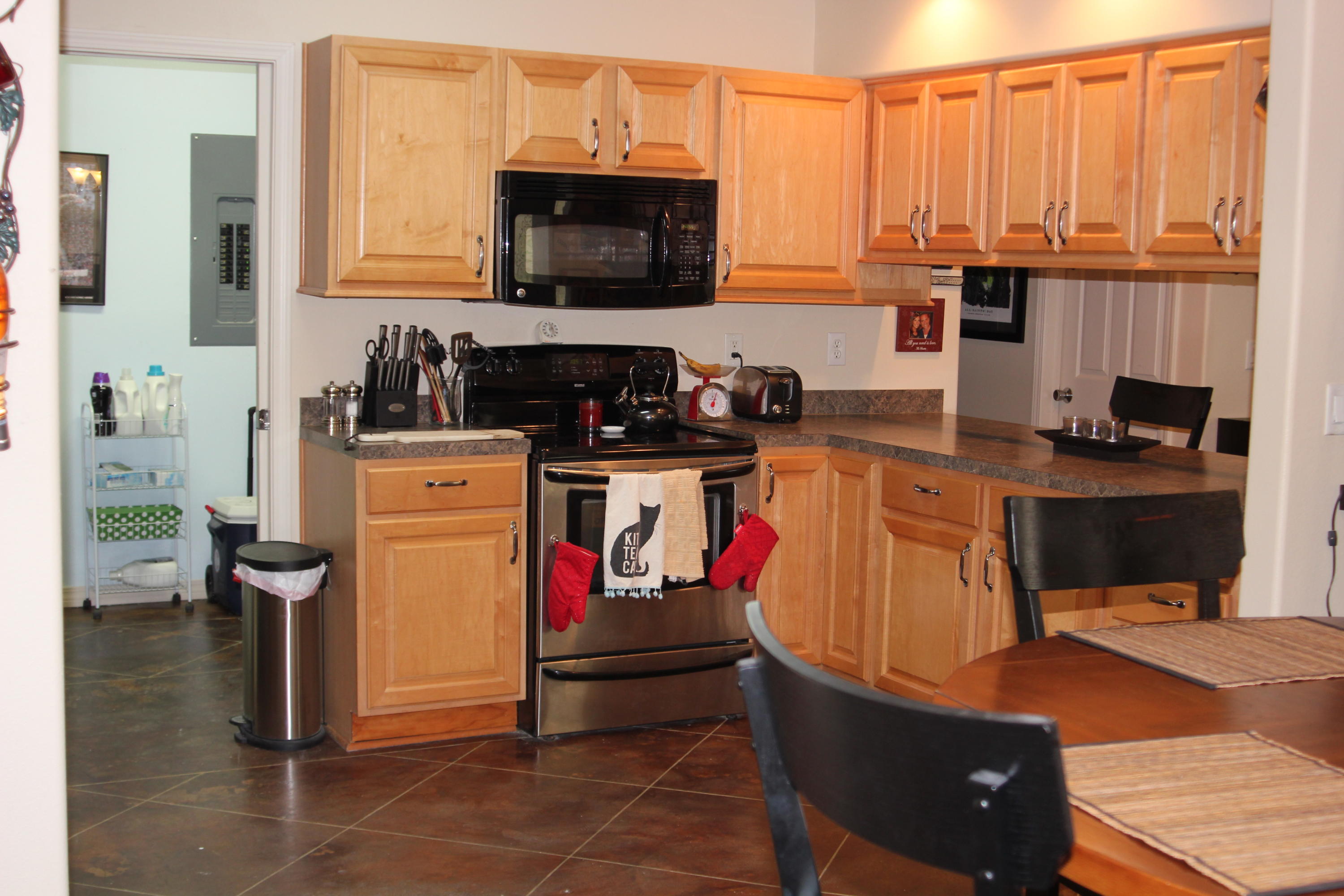 85 Indian Woman Road Santa Rosa Beach, FL 32459 - Photo 12 of 44 a kitchen with stainless steel appliances a stove a sink and white cabinets