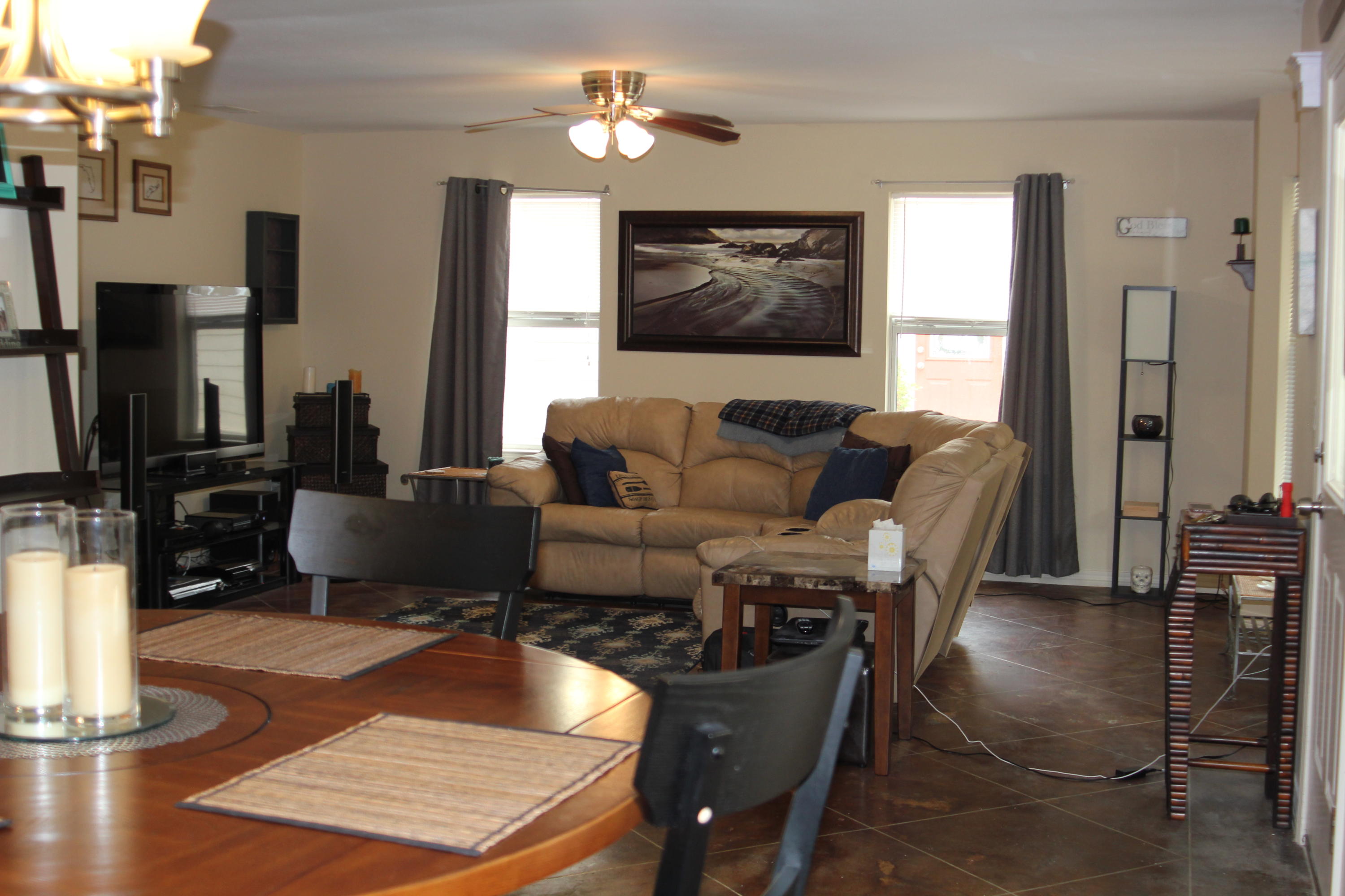 85 Indian Woman Road Santa Rosa Beach, FL 32459 - Photo 14 of 44 a living room with furniture a flat screen tv and a fireplace